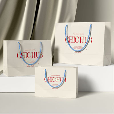 Besondere Kleidung Einkaufstüten Verpackung Luxus Elfenbeinkarton Kraftpapier Billigpreis Einkaufstüte Geschenkgutschein