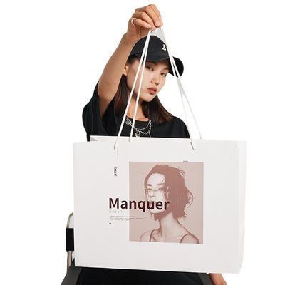 Besonders gedruckte weiße Papier-Luxus-Einkaufstaschen mit Band-Handgriff-Design